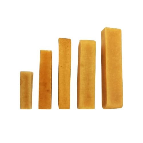 An image of five cheddar cheese sticks arranged in ascending order of height against a white background. This image may represent the different sizes of dog chews that the company produces.